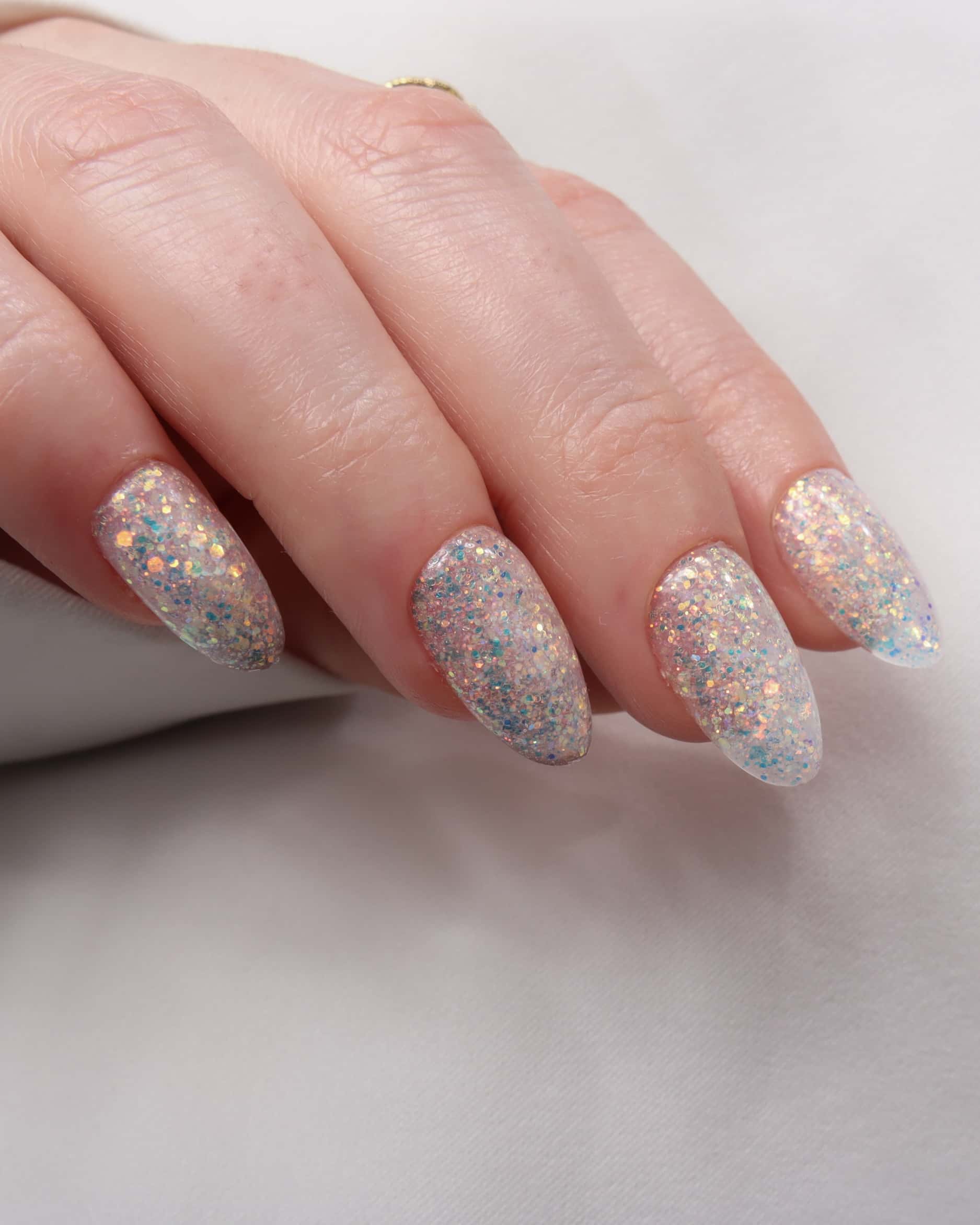 Glitter nails. Encapsulated glitter. Reusable nail extensions. 
