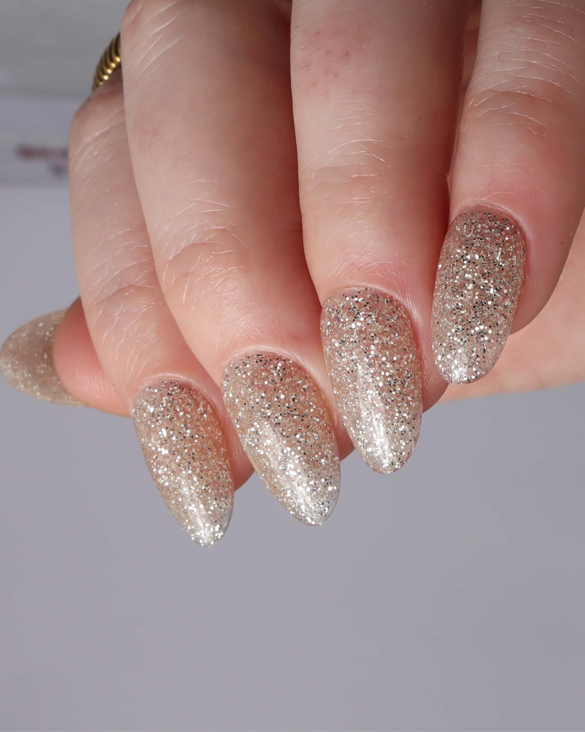 Glitter nails. Encapsulated glitter. Reusable nail extensions. 
