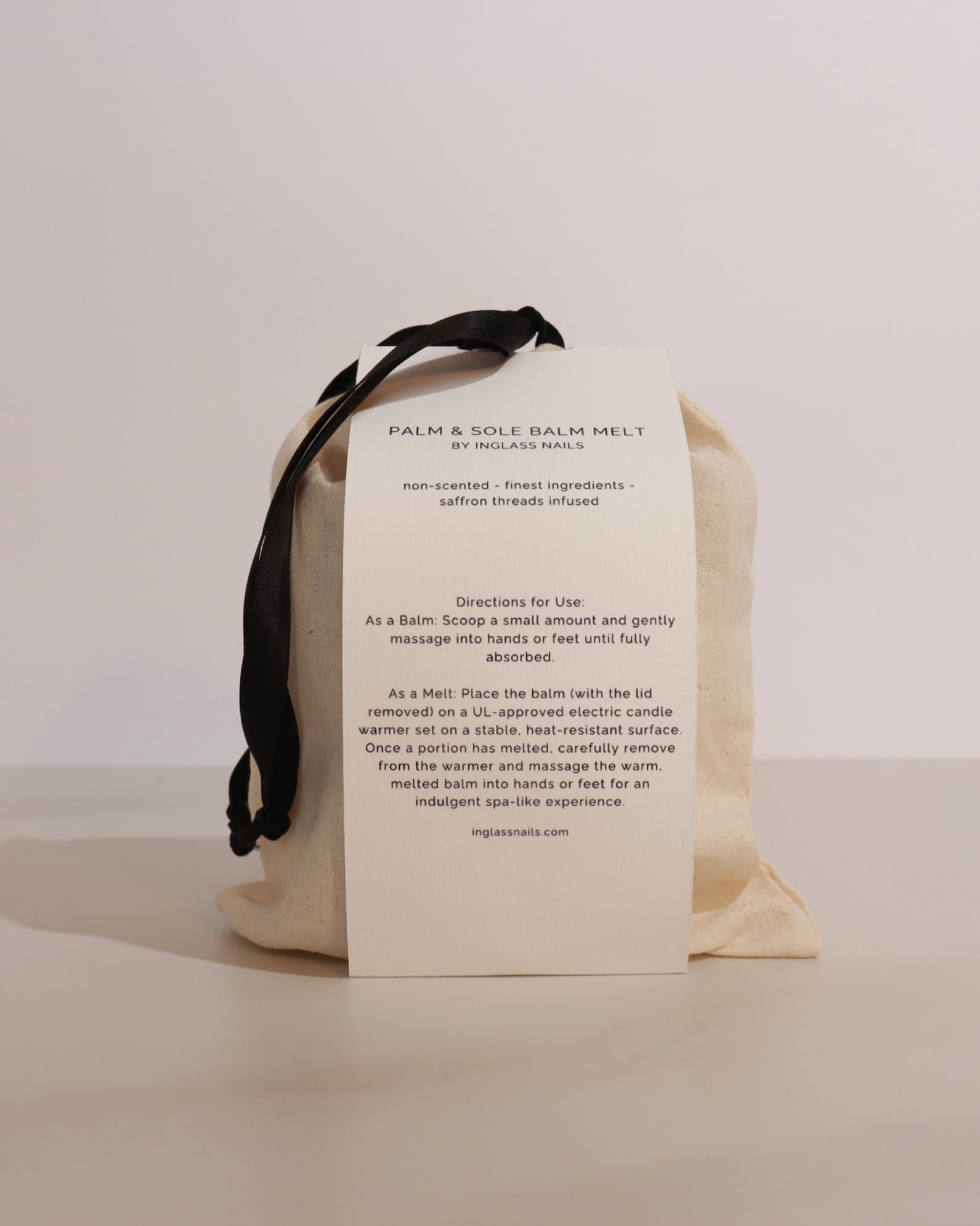 Palm and sole balm melt packaging with instructions on a beige background