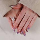 purple flowers nail extensions on hand